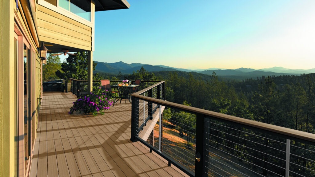 TimberTech Antique Leather elevated deck with outdoor seating and soft lighting.