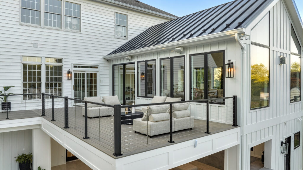 Trex Signature cable railing lakefront deck with modern composite boards, elegant cable deck railing ideas.