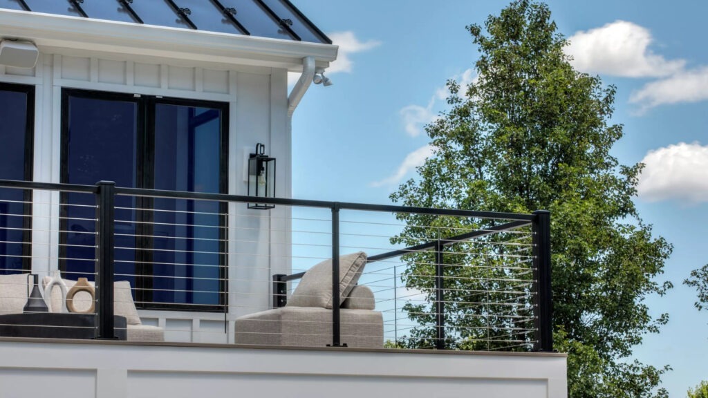 Trex Signature cable deck railing on lakefront deck, stylish cable railing ideas for lakeside homes.