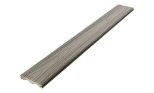 The image shows a single Veranda Stone Gray composite deck board with a grooved edge profile. The surface features a soft, cool-toned gray color with a realistic woodgrain pattern. This board highlights the smooth, low-maintenance finish of the Veranda Builder’s Select collection.