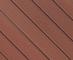 Detailed image of Envision EverGrain composite decking in Redwood, highlighting warm red-brown tones and pronounced woodgrain patterns. The textured surface captures the look of traditional redwood lumber with consistent color and depth across each board.