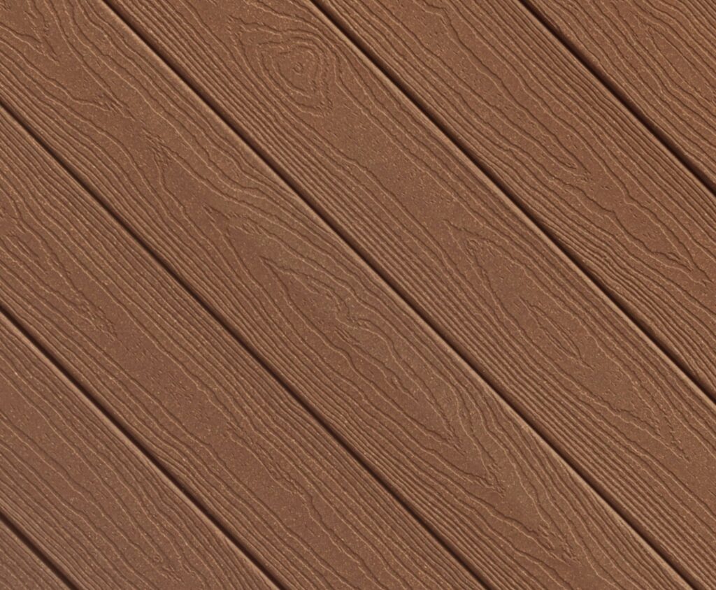 Close-up of Envision EverGrain composite decking in Weathered Wood, featuring soft brown and taupe hues with a naturally aged appearance. The deep grain pattern adds visual character while delivering a durable, splinter-resistant decking surface.