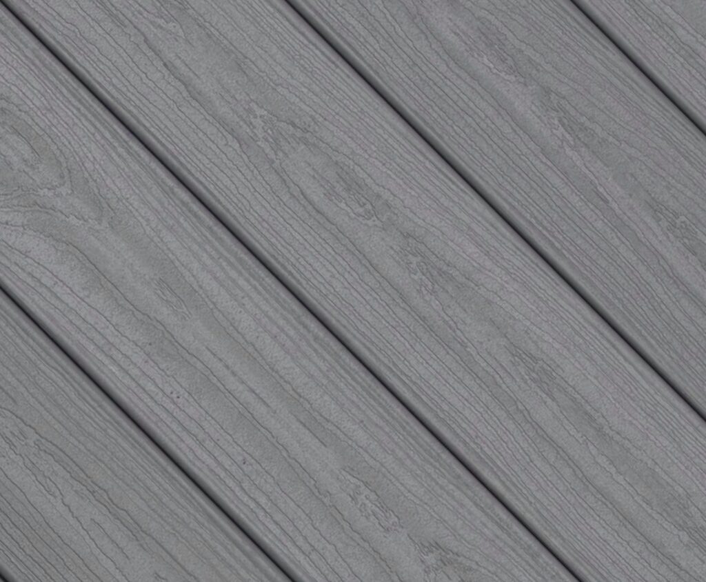 Close-up swatch of Envision Ridge Premium Alpine Fog composite decking featuring a cool gray tone with subtle grain detail and a soft, weathered wood appearance.