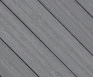 Close-up swatch of Envision Ridge Premium Alpine Fog composite decking featuring a cool gray tone with subtle grain detail and a soft, weathered wood appearance.