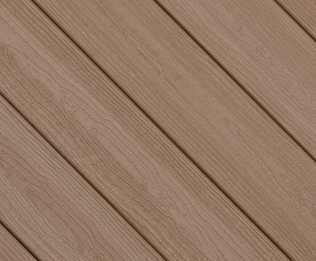 Close-up swatch of Envision Ridge Premium Sandstone composite decking highlighting a light tan color with soft grain variation for a clean, neutral wood look.