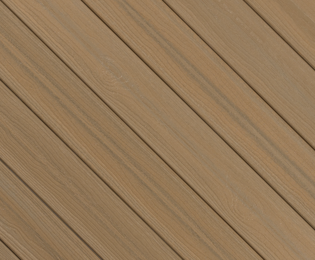 Close-up of Envision Ridge Premium Baja Tide composite deck boards showing inviting golden sand-inspired tones, natural color variation, and refined woodgrain texture across the board surface.