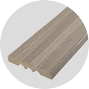 Close-up of a Ridge Premium Kodiak Bay composite decking board with a square-edge profile, showcasing deep gray-brown tones inspired by rocky shorelines and sheltered coastal coves. The layered color depth and pronounced woodgrain texture create a bold, natural appearance ideal for exposed edges, borders, and stair applications requiring face fastening.