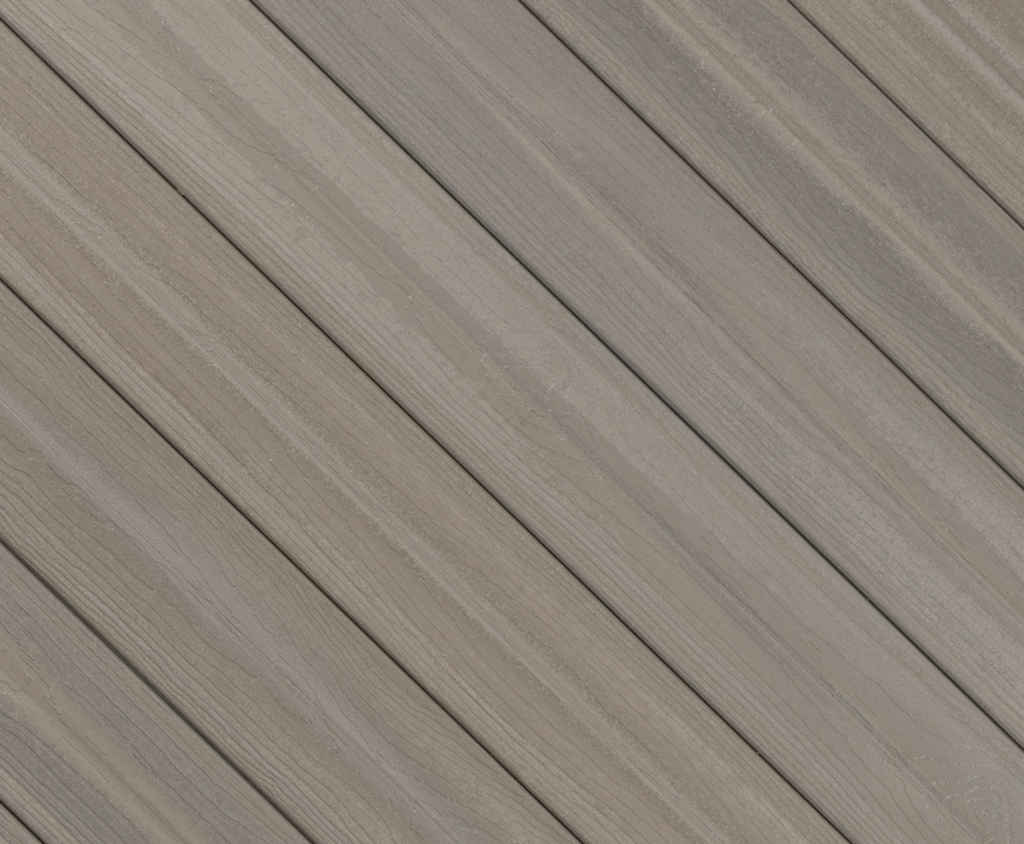 Close-up of Envision Ridge Premium Silver Drift composite deck boards showcasing weathered gray hues, subtle driftwood undertones, and finely detailed woodgrain texture inspired by coastal boardwalks.
