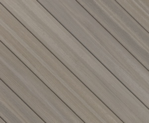 Close-up of Envision Ridge Premium Silver Drift composite deck boards showcasing weathered gray hues, subtle driftwood undertones, and finely detailed woodgrain texture inspired by coastal boardwalks.