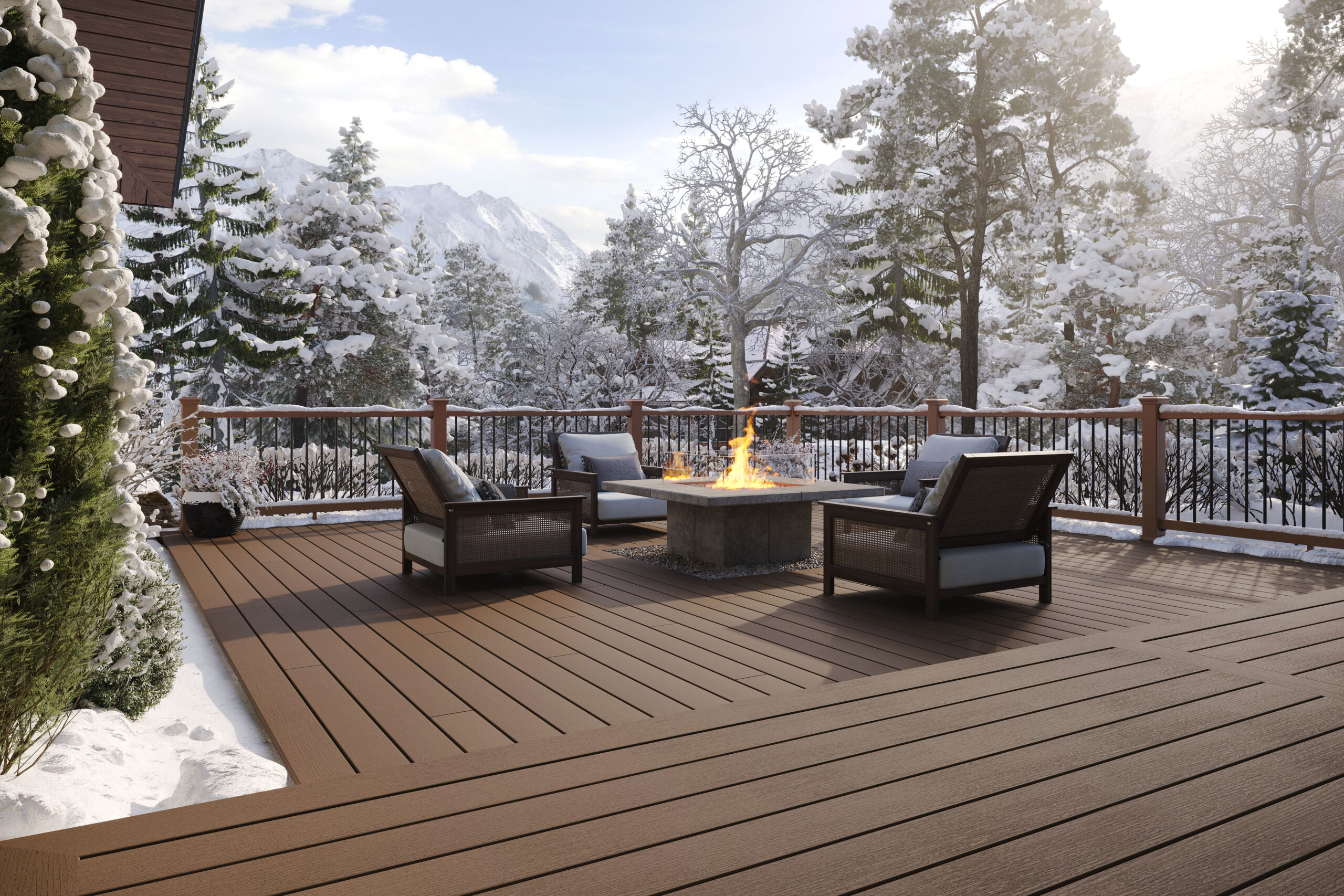 A Trex composite deck surrounds a fire pit while snow covers the railing and surrounding trees during winter weather conditions. Cold temperatures and melting snow can affect traction, making winter an important factor when evaluating deck surface safety.