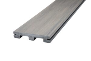 Wolf Haven Storm decking shown as a grooved-edge board with a lightweight scalloped profile, engineered for concealed fastening systems. Precision-milled grooves allow for uniform spacing and a smooth, hardware-free deck surface that highlights the board’s subtle grain and muted gray tones.