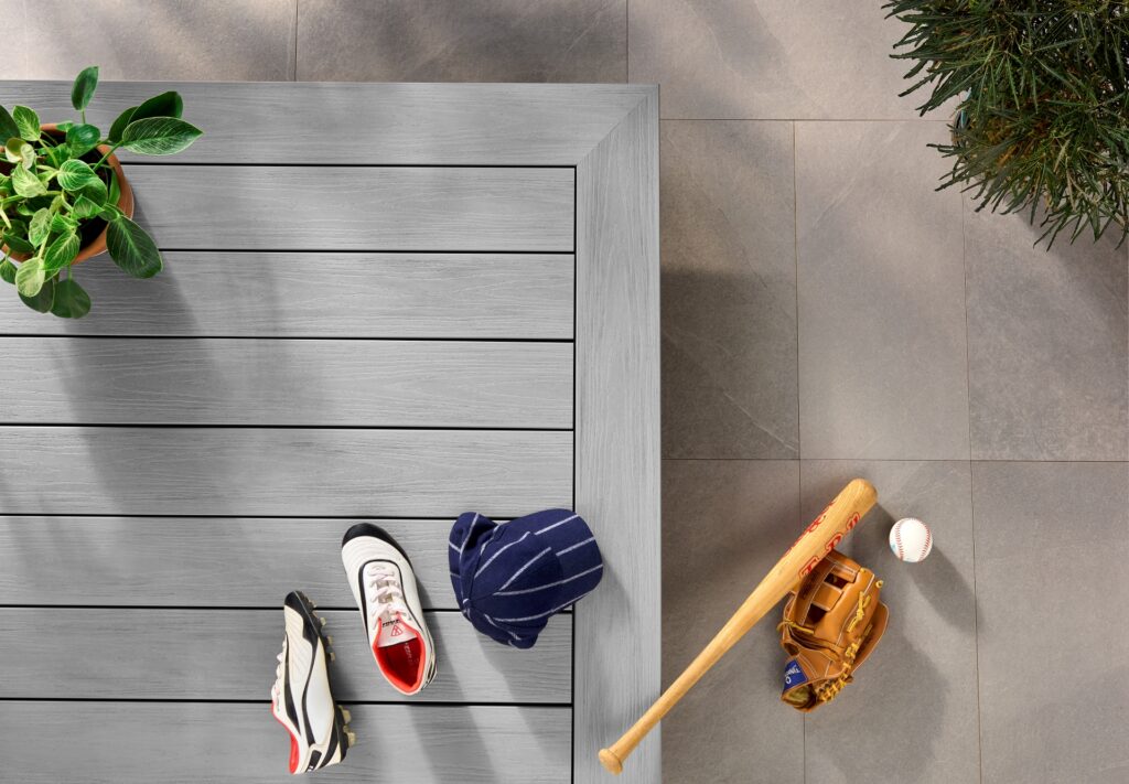 Wolf Haven Storm cellular PVC decking installed in a modern outdoor space, featuring cool gray boards with subtle charcoal variation, clean picture framing, and a durable low-maintenance deck surface designed for everyday use.