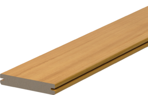 Fiberon Novus Golden Cedar grooved-edge composite decking board shown in a close-up product view. The board features warm honey-gold tones with subtle cedar-inspired grain detailing and precision-cut side grooves designed for hidden fastener installation.