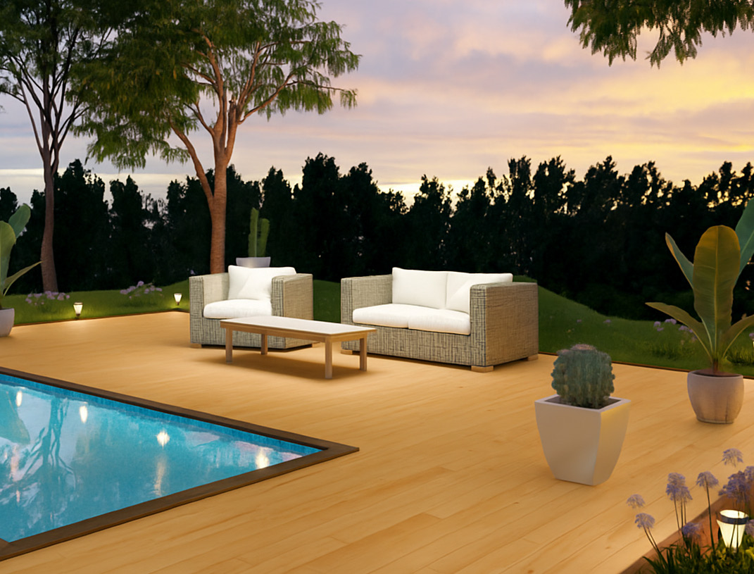 Fiberon Novus Golden Cedar composite decking installed around a modern backyard pool at sunset. The light golden wood tone enhances the outdoor seating area with woven lounge furniture, clean landscaping, and soft lighting for a warm, inviting atmosphere.