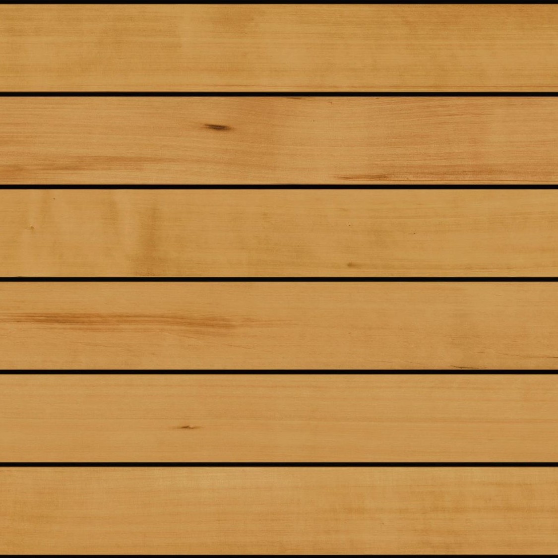 Fiberon Novus Golden Cedar composite decking board featuring warm honey-gold tones with subtle cedar woodgrain detailing and a smooth, natural hardwood-inspired finish.