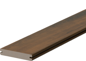 Fiberon Novus Natural Ipe grooved-edge composite decking board shown in a product close-up. The board features deep brown tones with rich espresso undertones and precision side grooves designed for hidden fastener installation.
