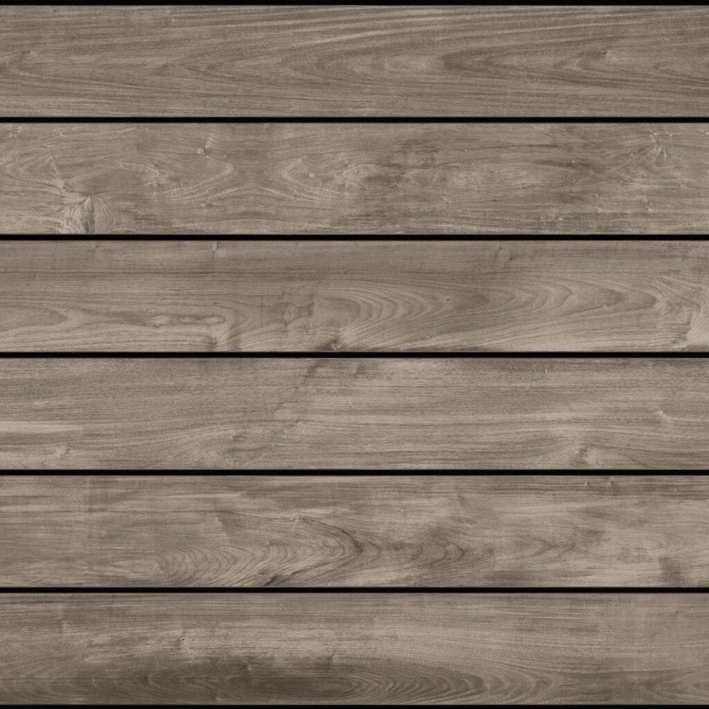 Fiberon Novus Weathered Ipe composite decking board in soft gray-brown tones with authentic, non-repeating woodgrain texture for a refined, weathered hardwood appearance.