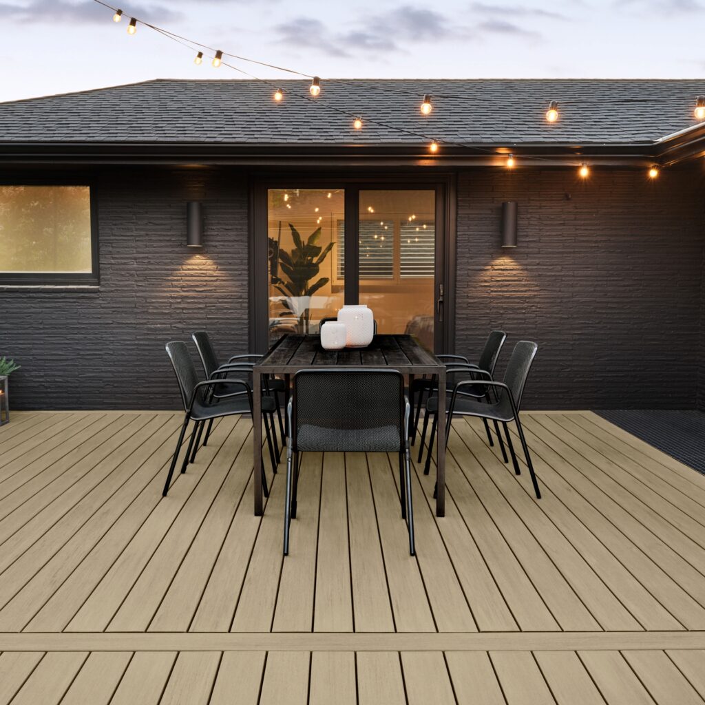 TimberTech Premier+ Natural Oak composite decking installed on a modern outdoor patio, featuring straight-grained hardwood texture, warm oak tones, and durable polymer-capped boards.