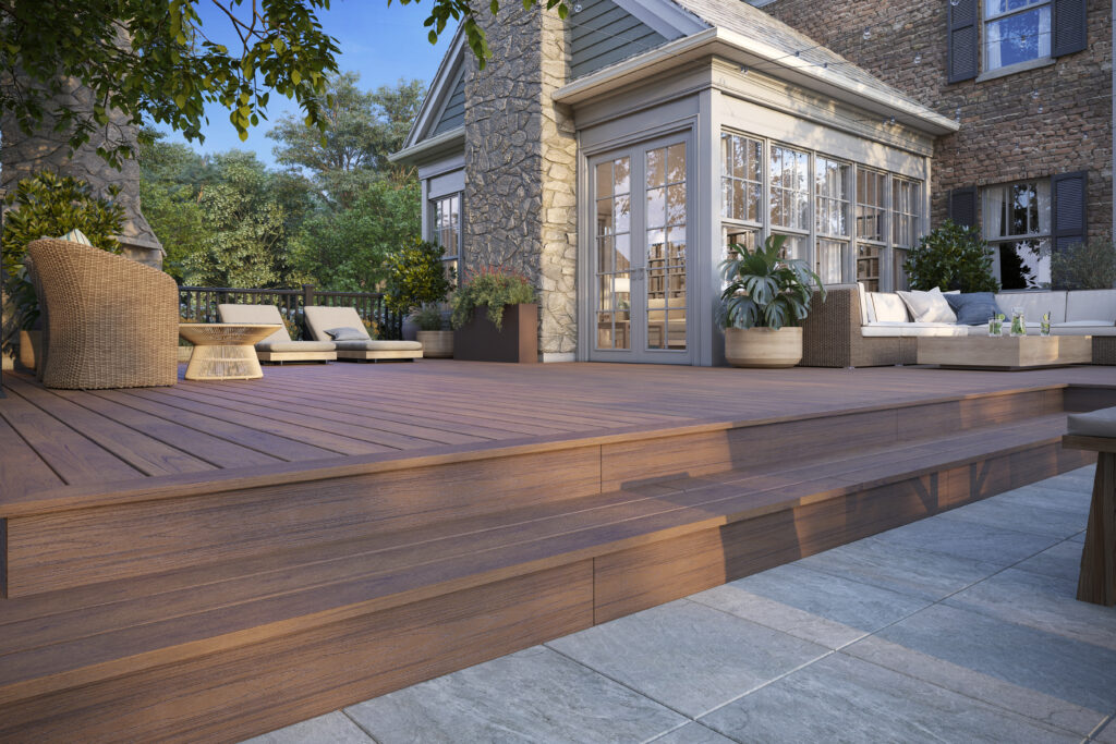 Trex Transcend Lineage composite decking boards in Hatteras color shown in a close-up swatch layout. The medium brown tone highlights the wood-inspired grain pattern used in composite decking boards.
