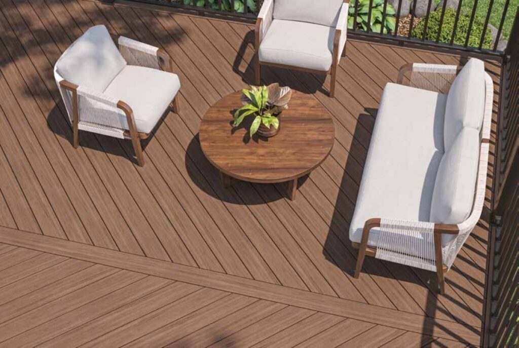 Deckorators Pioneer Coastland Brown decking in a modern outdoor seating area with diagonal board layout, featuring rich brown tones and natural wood-inspired texture.