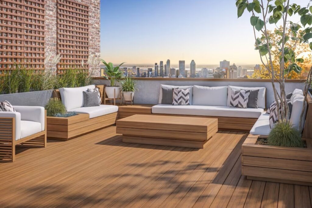Elevated backyard deck in Timberline Brown with built-in seating, planters, and a warm, inviting outdoor living layout.