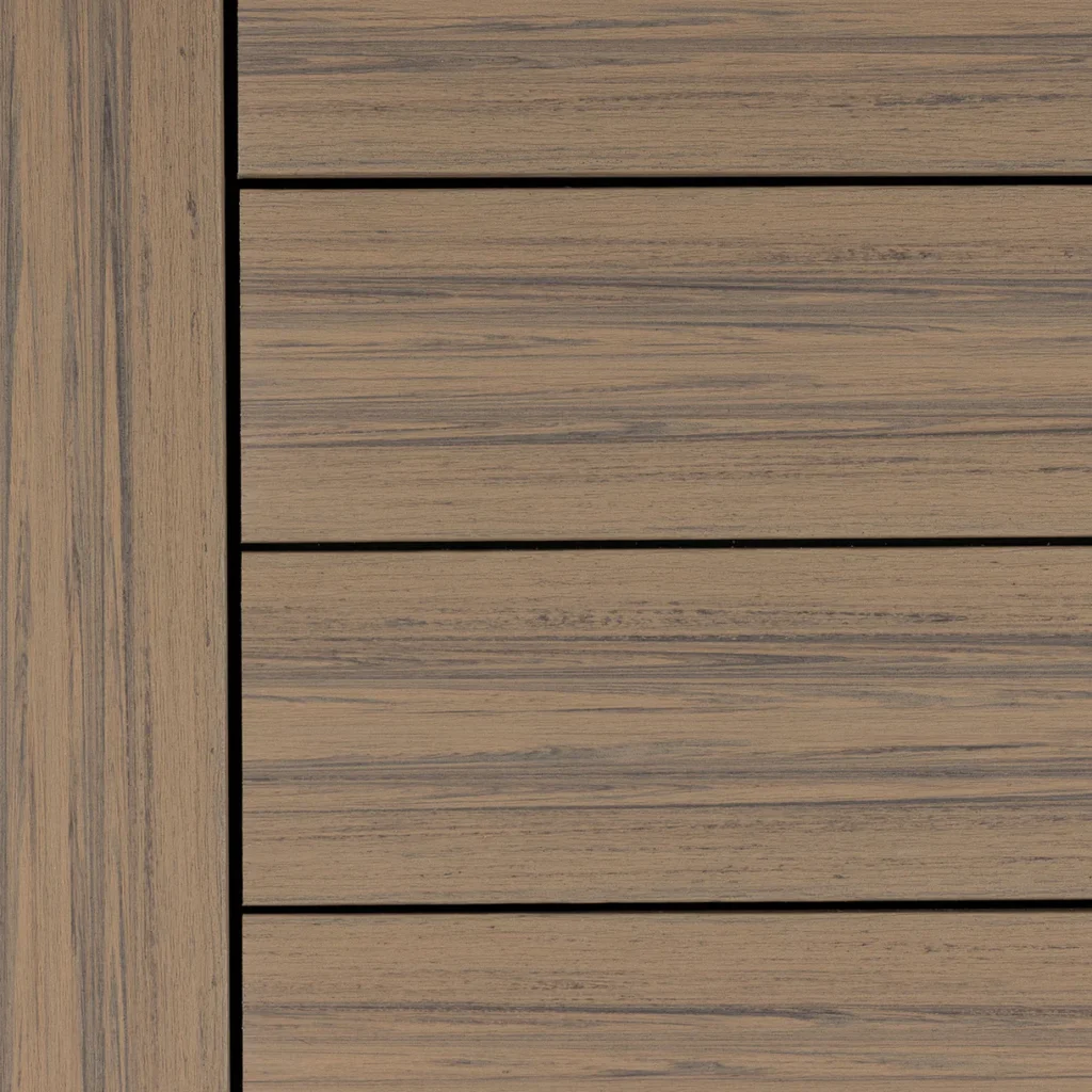 Close-up swatch of Deckorators Voyage Costa composite decking boards installed horizontally with a coordinating picture frame board on the left. The boards feature a warm medium-brown tone with natural wood grain texture and subtle color variation. This mineral-based composite decking color adds warmth to outdoor spaces while maintaining a durable deck surface.