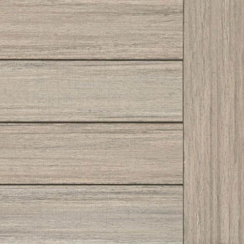 Close-up image of TimberTech French White Oak composite decking boards arranged horizontally with a coordinating border board. The boards feature a light natural oak tone with soft grain variation. This lighter decking color creates a bright deck surface that works well in sunny outdoor spaces.