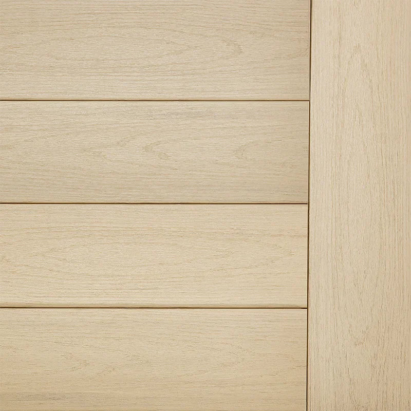 Product swatch of TimberTech Toasted Wheat composite decking boards showing a warm golden wood tone and subtle grain detail. The boards are installed horizontally with a matching vertical border board. This warm composite decking color adds natural character while maintaining a smooth deck surface.