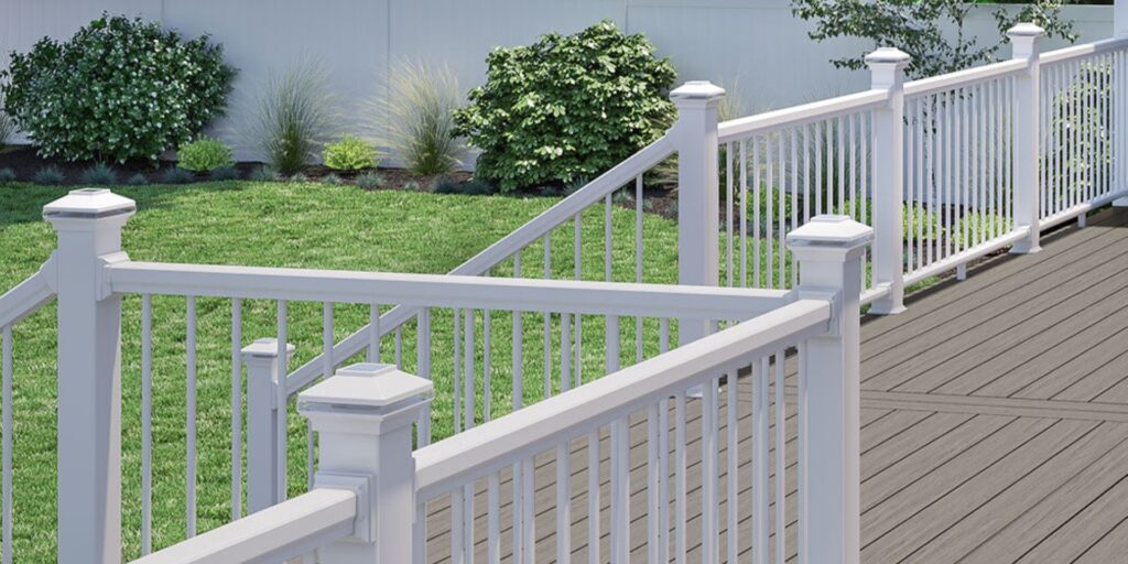 Deckorators composite deck railing in white with vertical balusters, providing a traditional look with durable, low-maintenance performance.