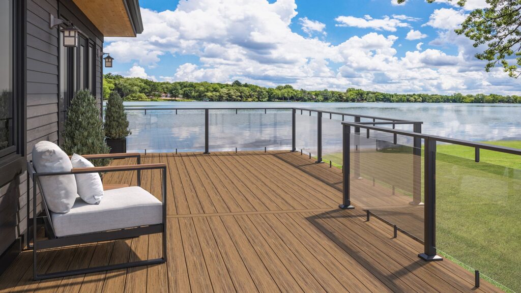 Deckorators glass deck railing with clear panels and dark aluminum framing, delivering unobstructed views with a sleek and modern outdoor design.