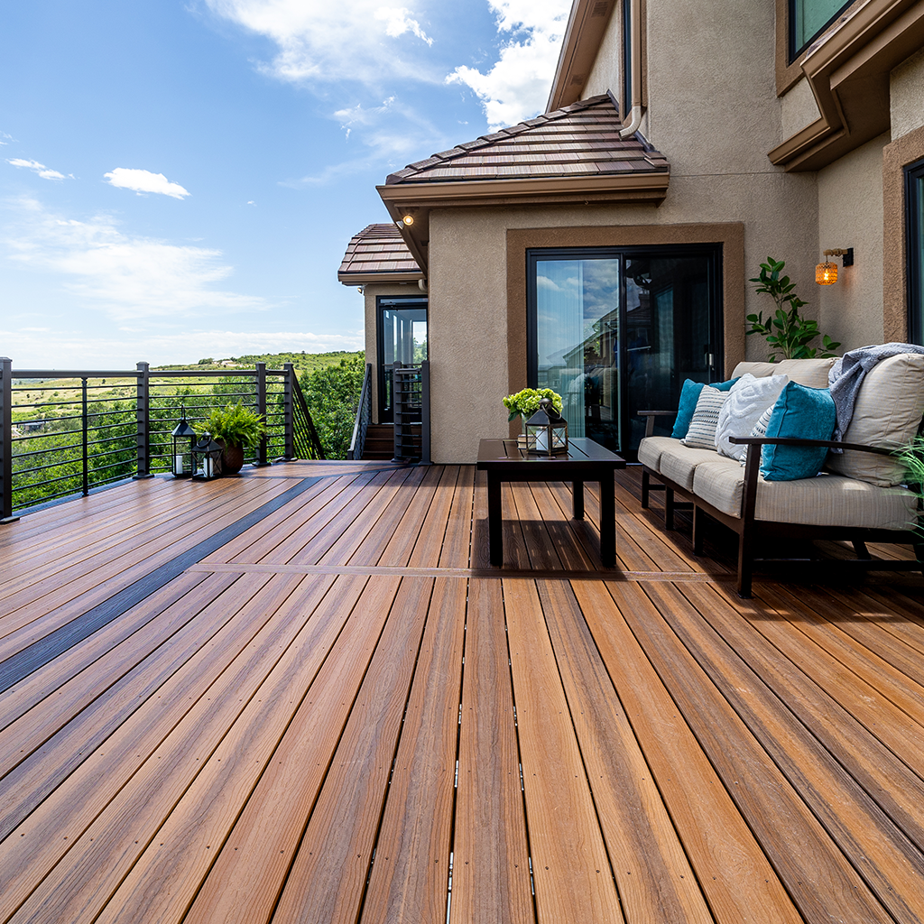 Envision composite decking with natural wood look beside a modern home and landscaped yard, built for long-lasting performance in Downers Grove.