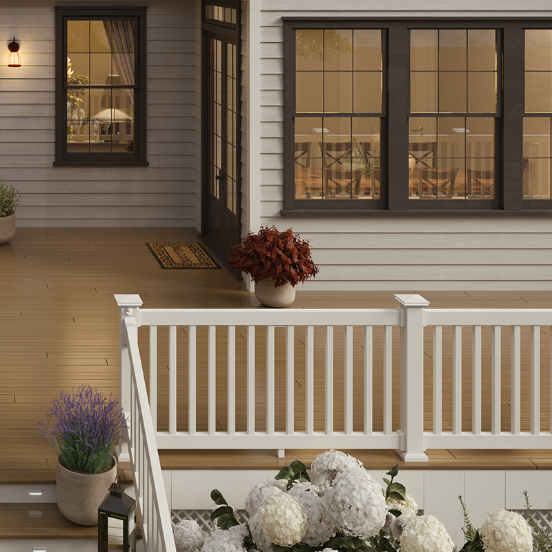 Envision Modern composite deck railing with a clean white frame and dark balusters, designed for a contemporary look with strong, low-maintenance performance.