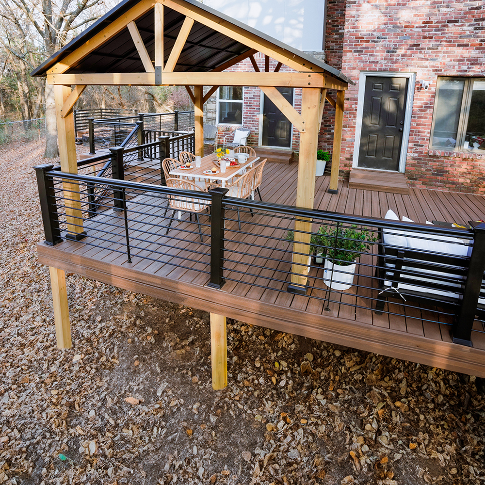 Elevated deck with cable railing system and stairs attached to a modern home, built for long-lasting performance in the Downers Grove area.