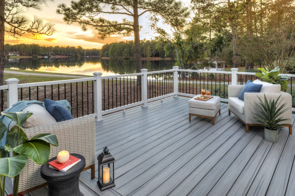 Trex railing with black balusters on a small backyard deck with grill and seating area, designed for homes in Downers Grove and nearby suburbs.