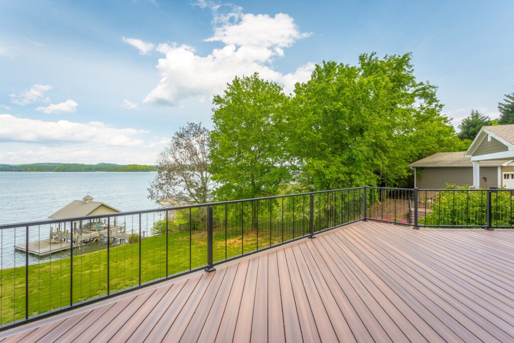Westbury VertiCable railing with vertical cable infill installed on a large lakeside deck, offering a sleek modern look with enhanced safety and open visibility.