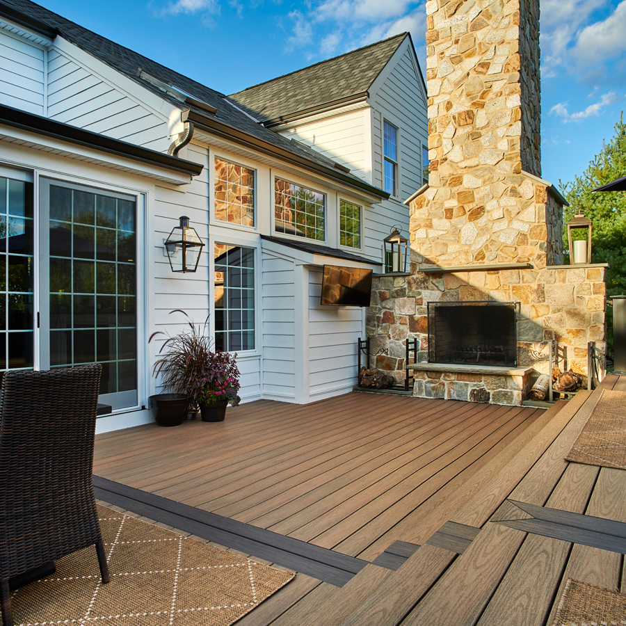 Wolf composite decking with outdoor seating and white railing, offering low-maintenance performance for homes in Downers Grove.