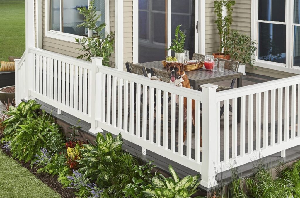 Wolf PVC deck railing system in white with vertical balusters installed on a residential deck, featuring low-maintenance, aluminum-reinforced construction for long-lasting outdoor durability.