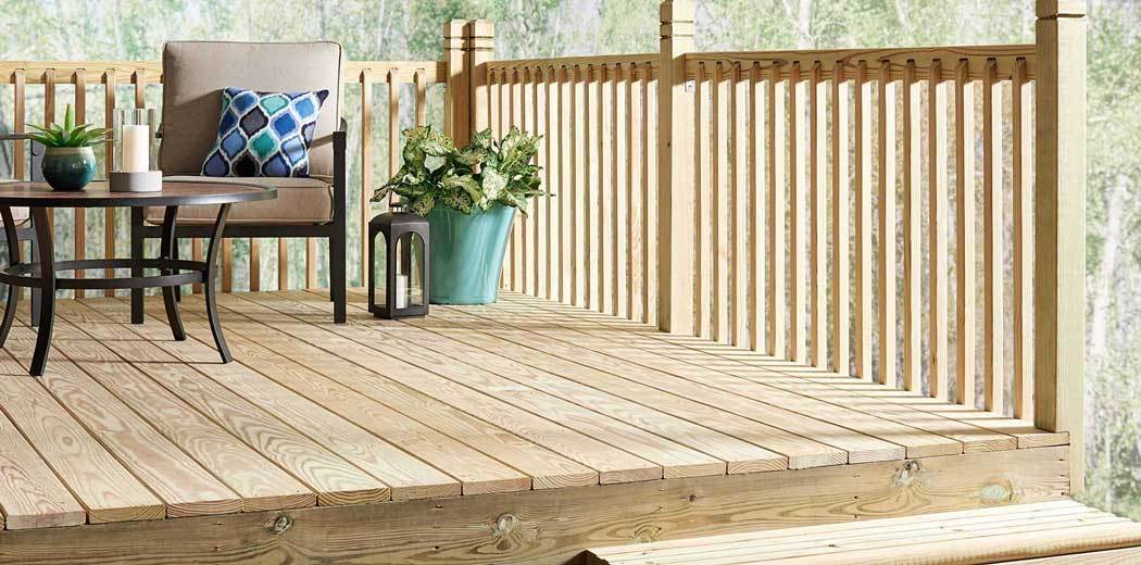 Residential wood deck with stairs and guardrails built to 2024 IRC pressure treated wood requirements