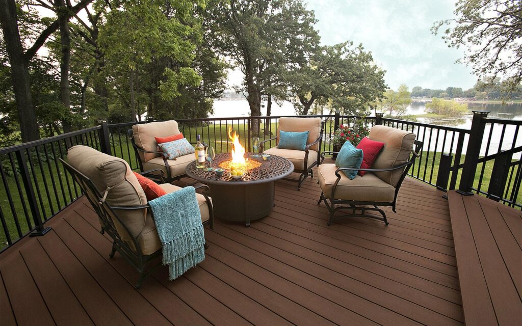MoistureShield Elevate Canoe composite deck with fire pit seating area overlooking lake
