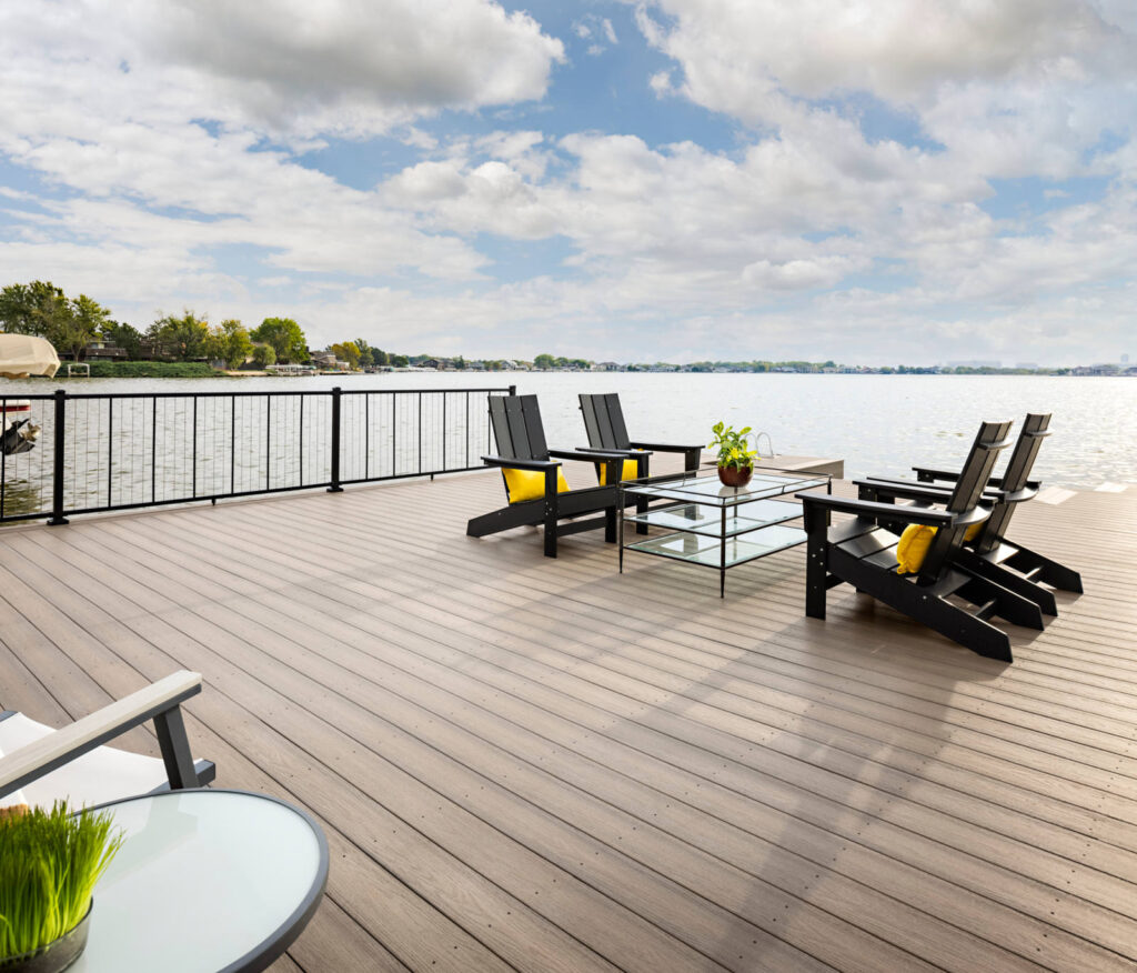 MoistureShield Elevate Riverbank composite deck waterfront patio with Adirondack chairs overlooking lake