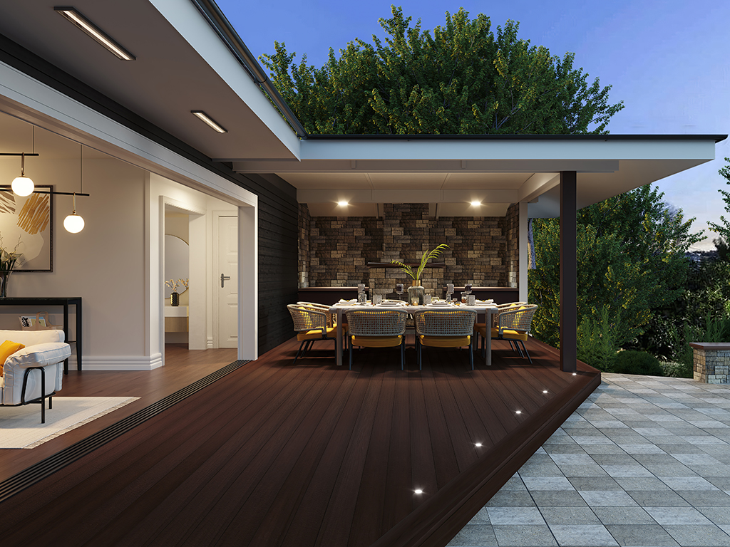 MoistureShield Meridian Mariner composite deck covered patio with outdoor dining set at dusk