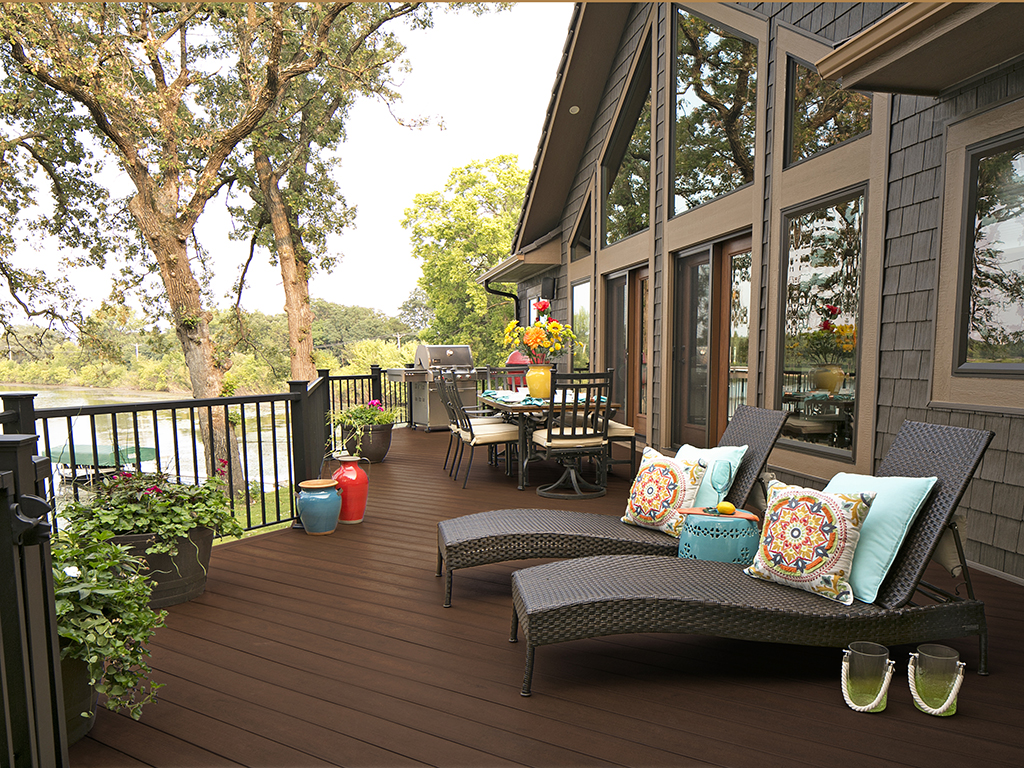 MoistureShield Meridian Mariner composite deck with lounge chairs and dining area overlooking river
