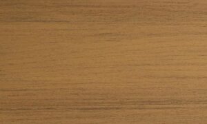 MoistureShield Meridian Shoreside composite deck board swatch with warm golden-brown wood grain