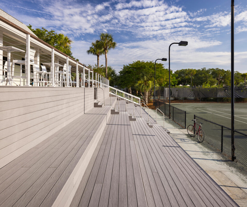 MoistureShield Vantage Cape Cod Gray uncapped composite deck steps and boardwalk near tennis courts