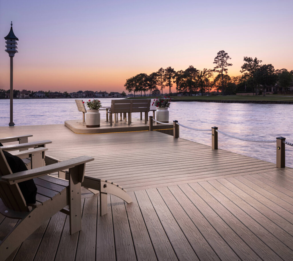 MoistureShield Vision Mochaccino composite deck on waterfront dock with seating and sunset view