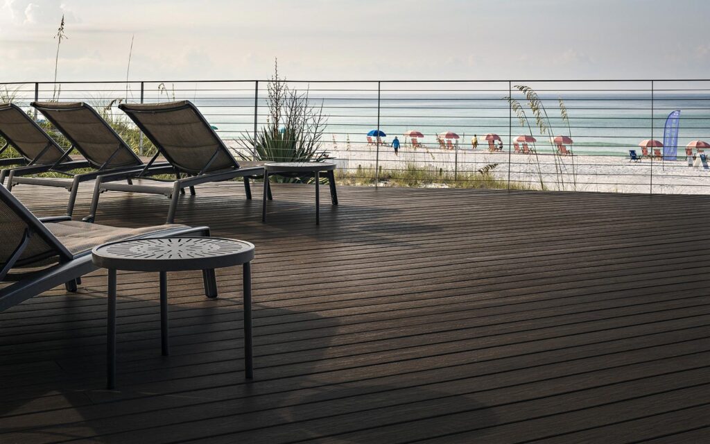 MoistureShield Vision Spanish Leather composite deck with lounge chairs overlooking beach and ocean