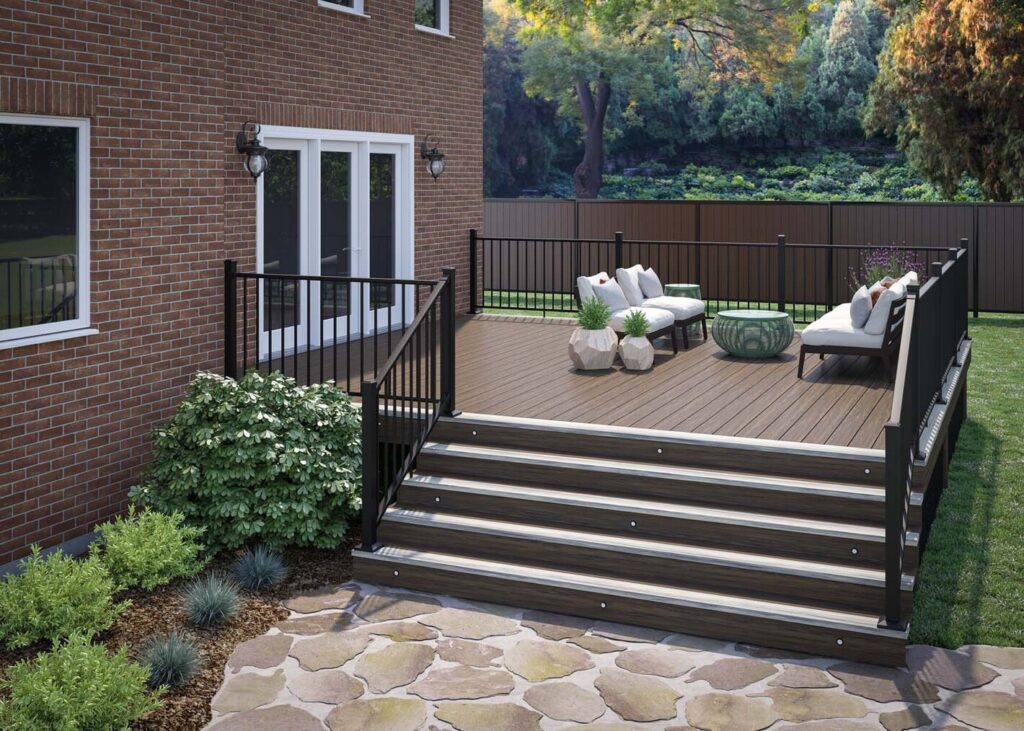 Textured black Deckorators Rapid Rail on a Voyage composite deck with lit stair risers, metal deck railing ideas for a brick home.