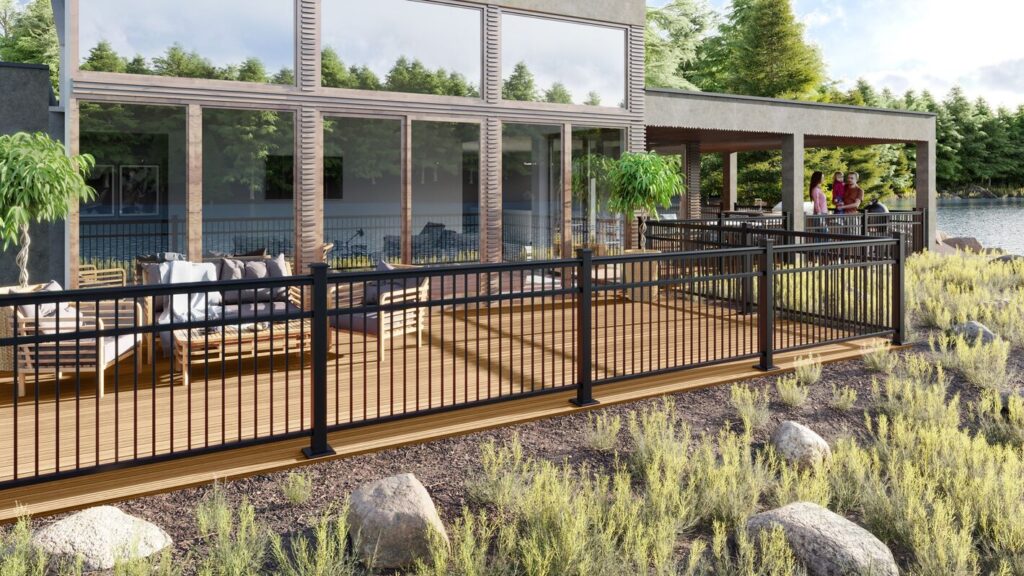 Envision Fairway Designer railing with black aluminum balusters and white posts on a raised backyard deck, two-tone metal deck railing ideas.