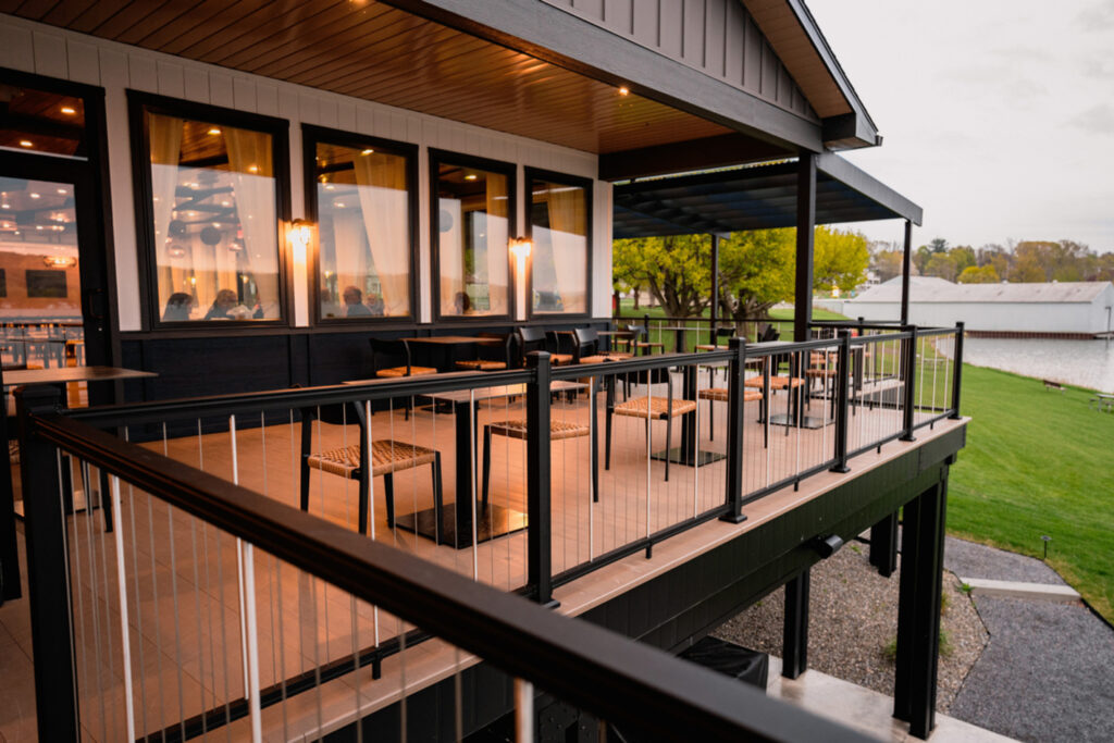 KeyLink American Series vertical cable railing on a restaurant deck overlooking a lake.
