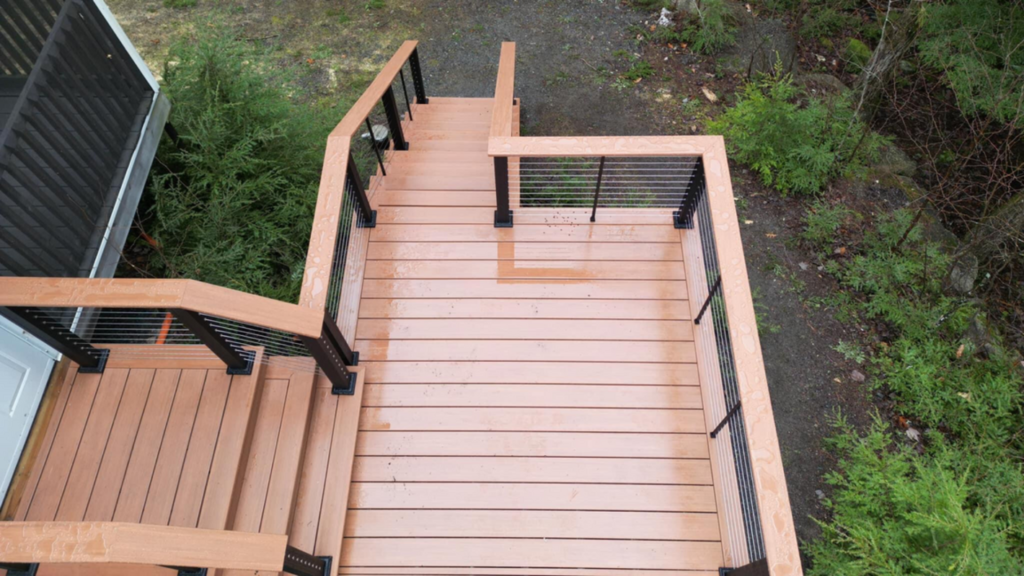 KeyLink Chesapeake Series horizontal cable railing on a composite stair landing seen from above, metal deck railing ideas.